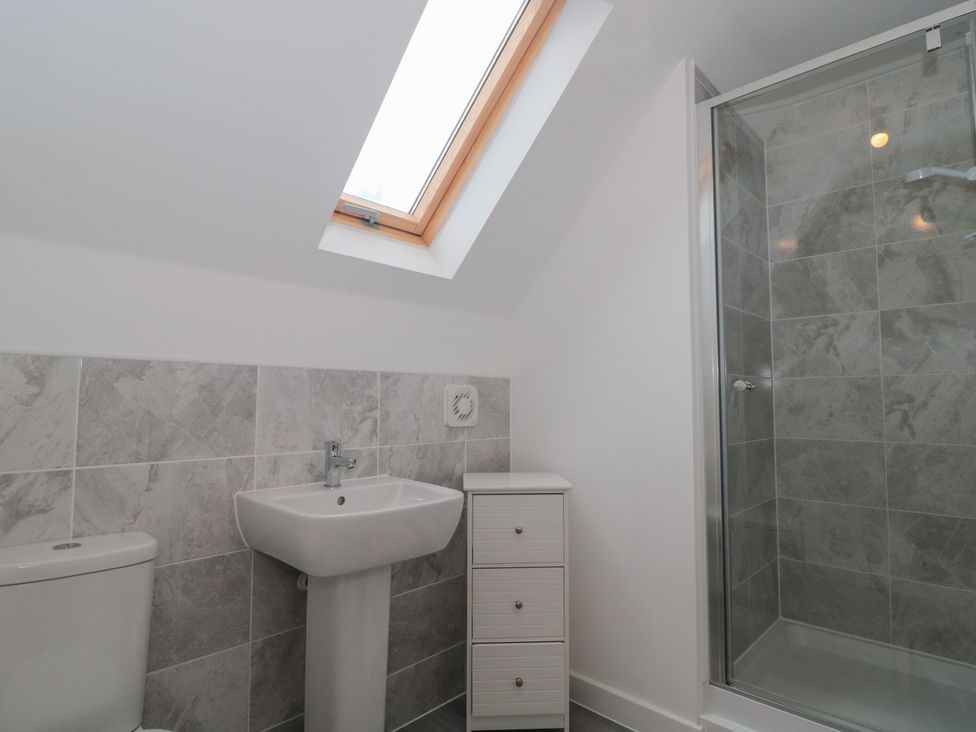 A bathroom with a shower and sink at 56 Strothers Avenue in Malvern