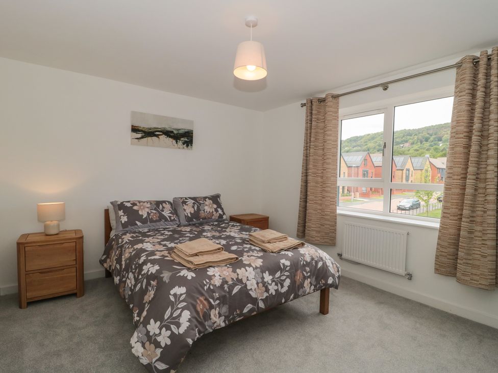 A bedroom with a bed and nightstand at 56 Strothers Avenue Malvern