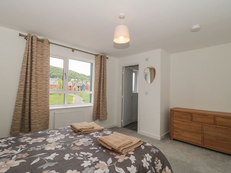 A bedroom with a bed and window views at 56 Strothers Avenue Malvern