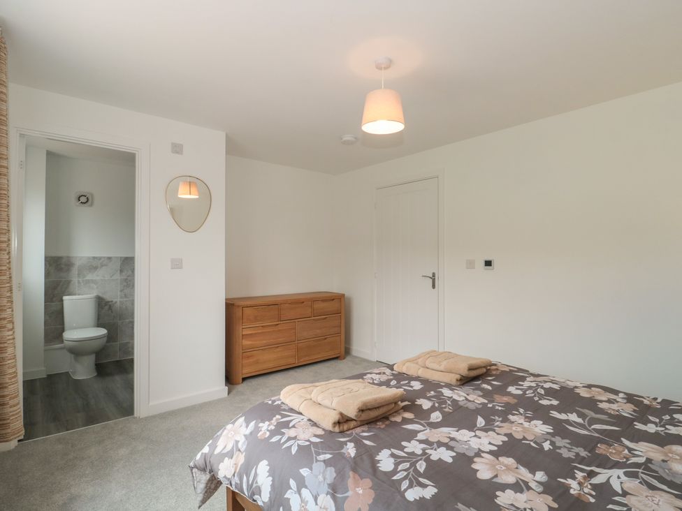 A bedroom with a bed and a dresser at 56 Strothers Avenue in Malvern