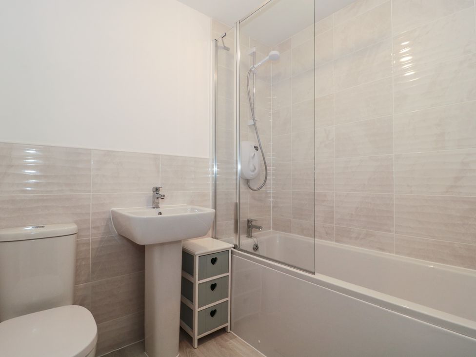 A bathroom with a shower and bathtub at 56 Strothers Avenue Malvern
