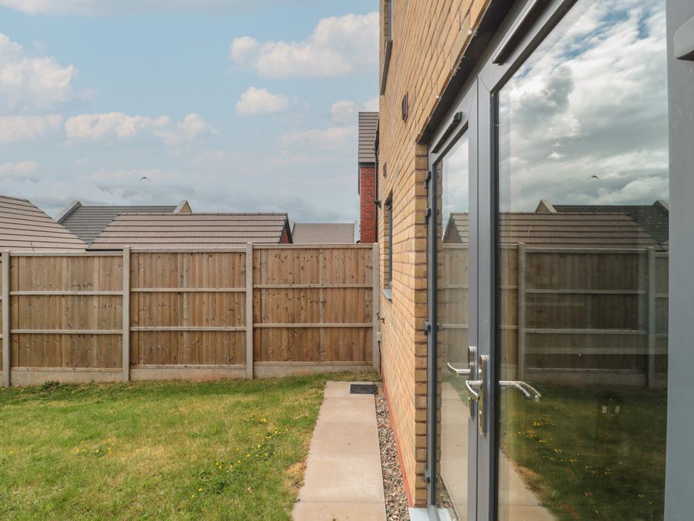 A garden view with a fence and glass door at 56 Strothers Avenue in Malvern