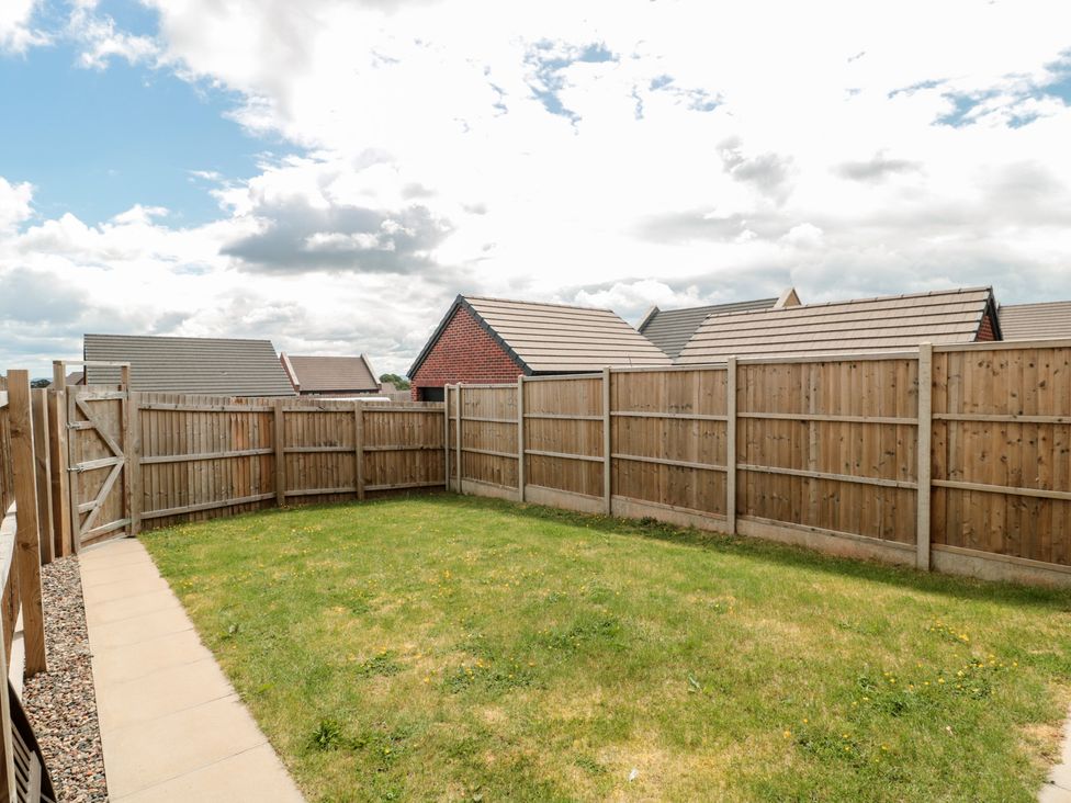 A garden with grass and wooden fence at 56 Strothers Avenue Malvern