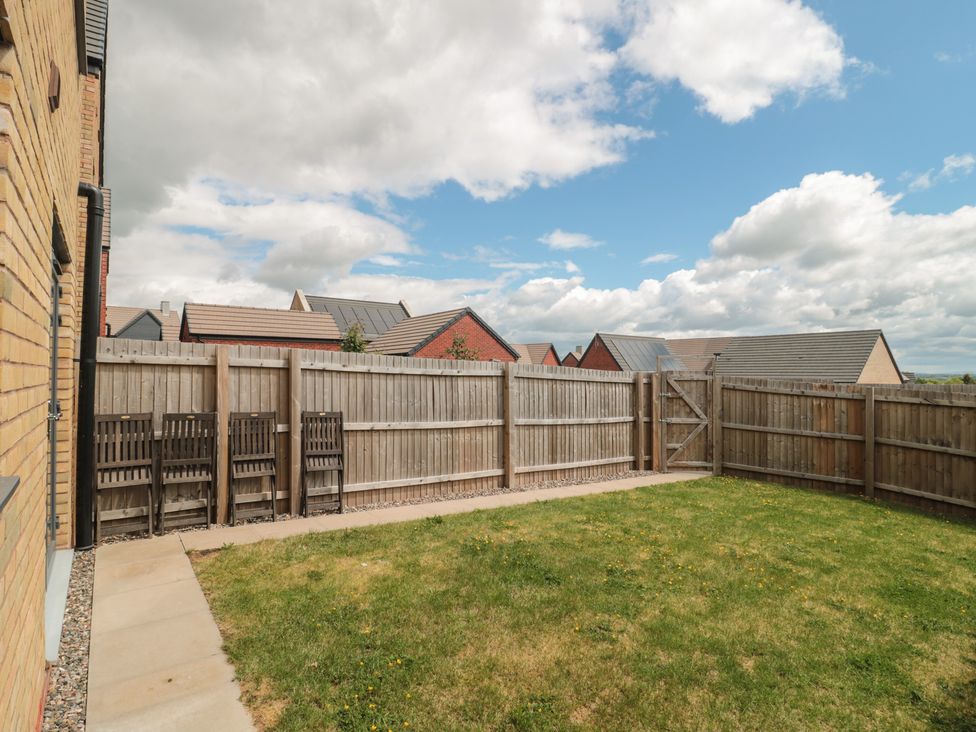A garden with grass and wooden fence at 56 Strothers Avenue, Malvern