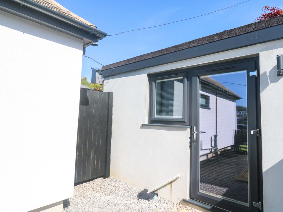 An outdoor area with a door and window at The Annex in Penzance