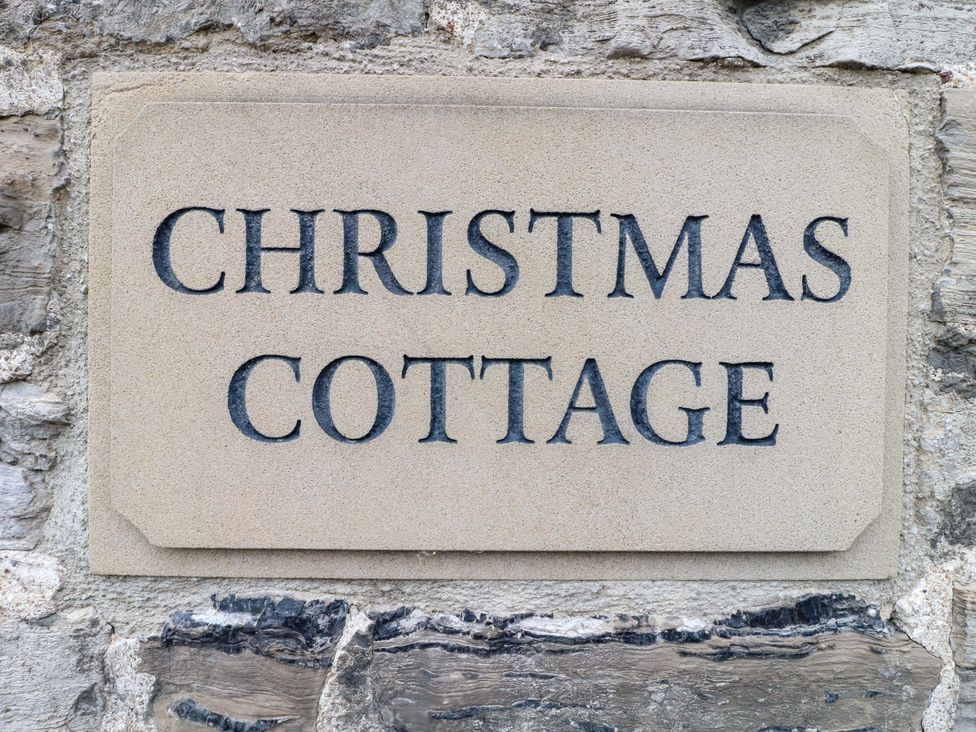 A sign that reads Christmas Cottage