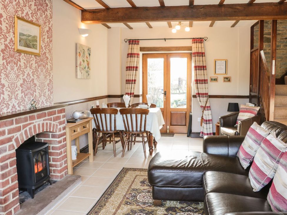 A dining room with a table and chairs at The Granary in Bucknell