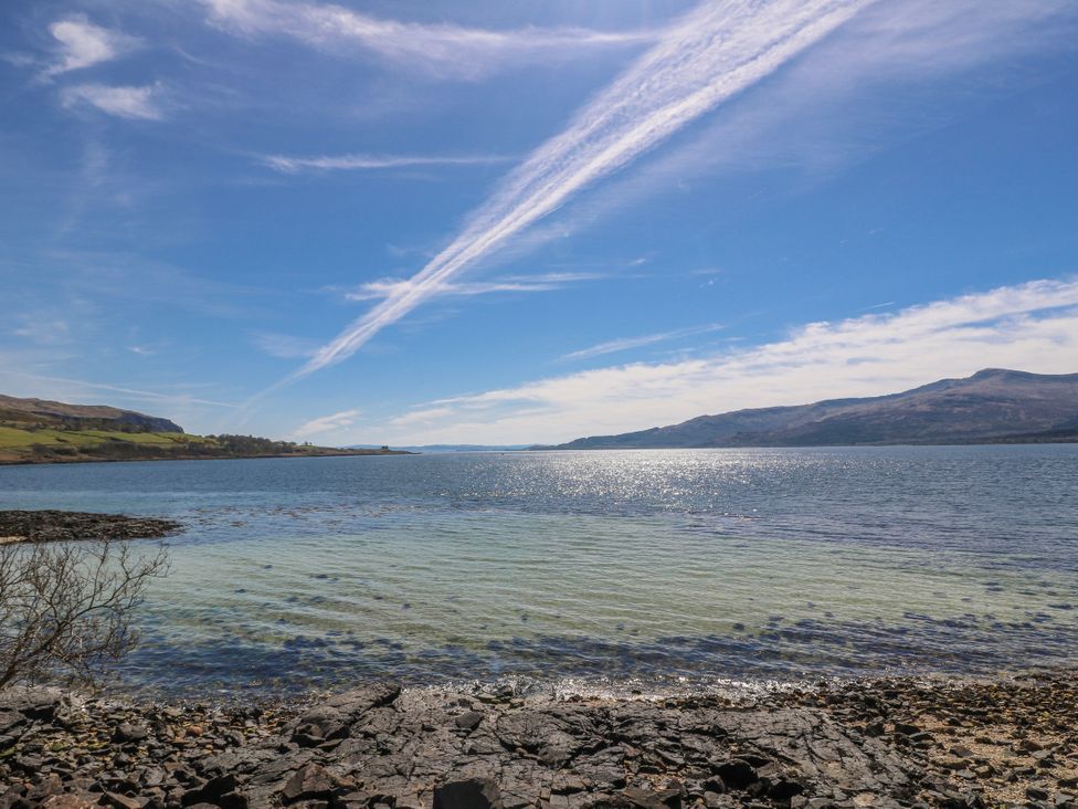 A coastal view with water and hills at Schoolhouse Oban