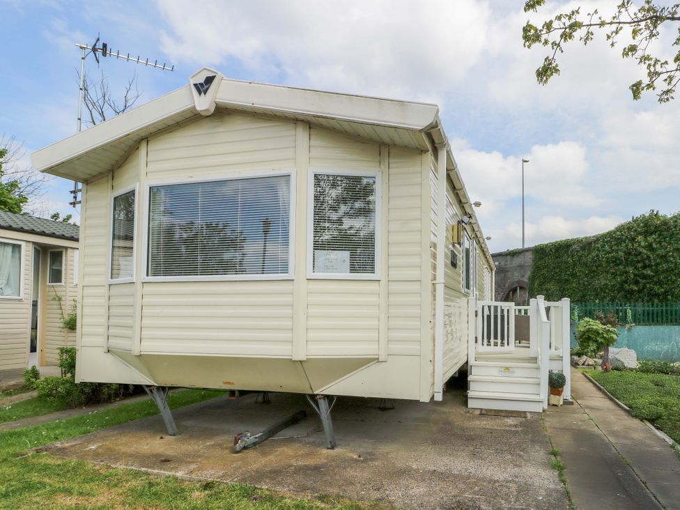 An outdoor view of a caravan with steps at W629 in Abergele
