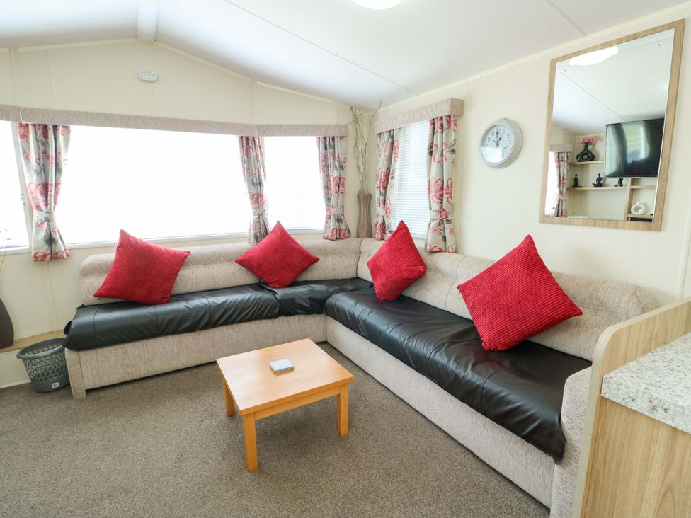 A living room with a sofa and coffee table at W629 Abergele