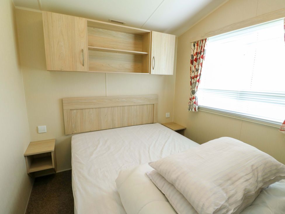 A bedroom with a bed and wall cabinet at W629 Abergele
