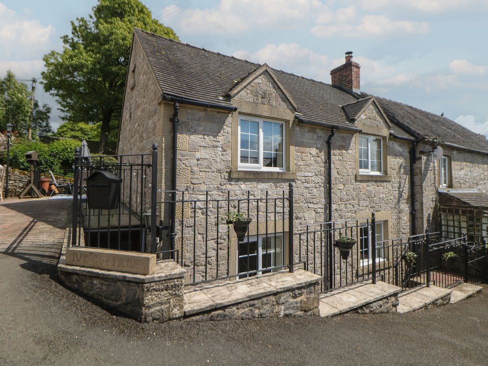 A house with a fence and steps at Ivy Cottage Matlock