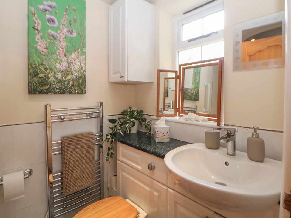 A bathroom with a sink and toilet at Ivy Cottage Matlock