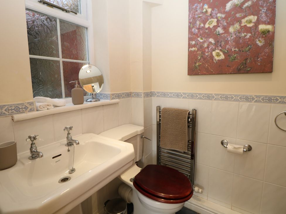 A bathroom with a sink and toilet at Ivy Cottage in Matlock
