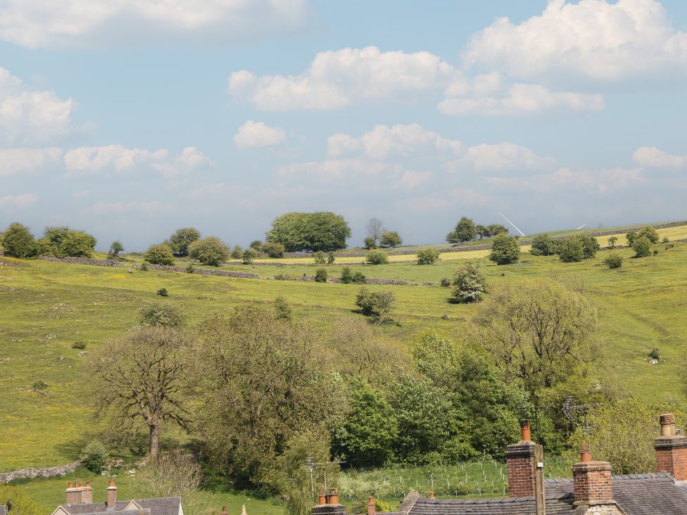 A landscape view with houses and trees at Ivy Cottage in Matlock