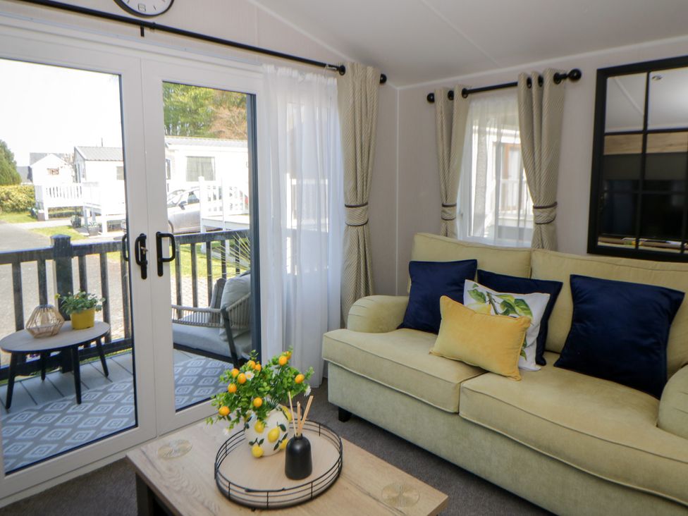 A living room with a couch and coffee table at Santa Maria in Llandysul