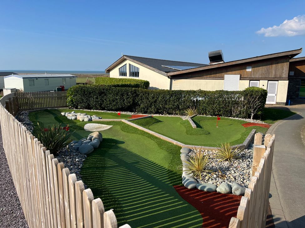 A mini golf course with rocks and plants at 26 Ocean View in Llwyngwril