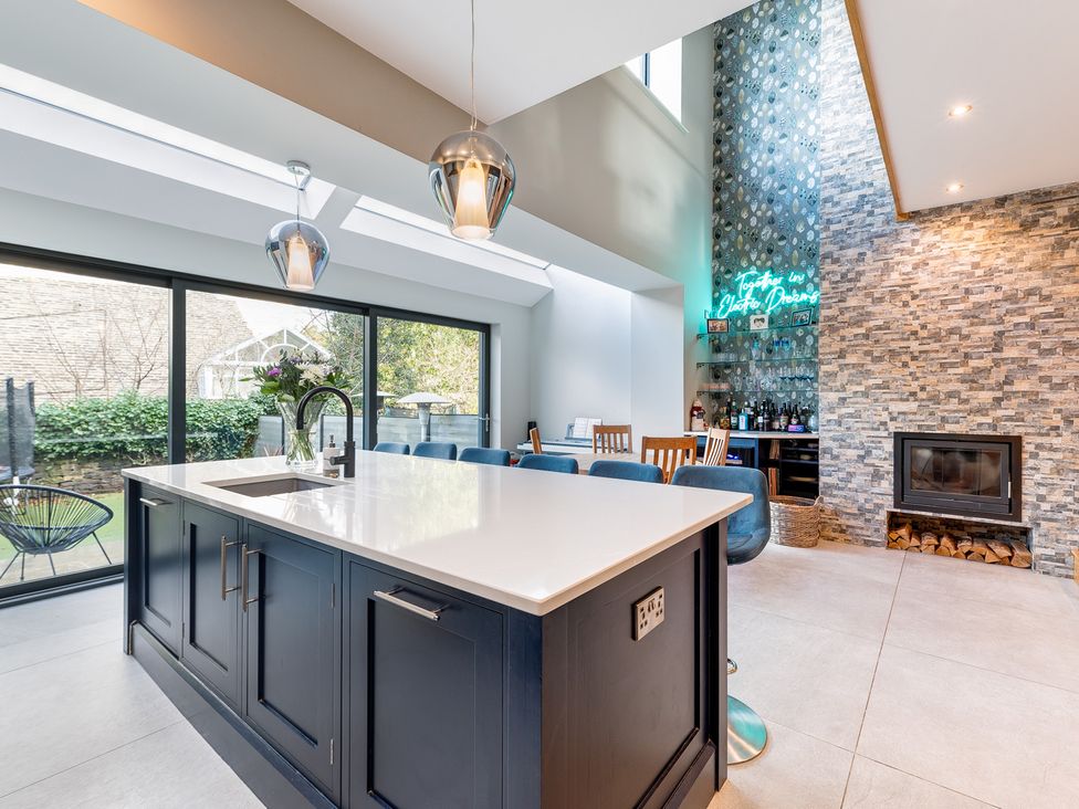 A kitchen with an island countertop and sink at The Grand Weave House in Shipley