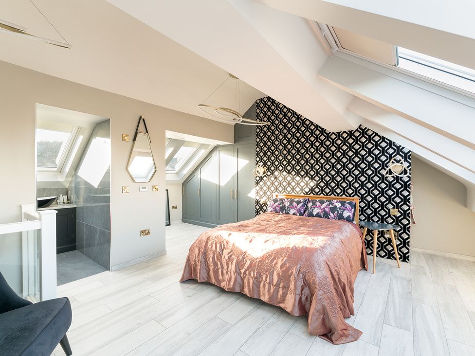 A bedroom with a bed and skylight at The Grand Weave House in Shipley