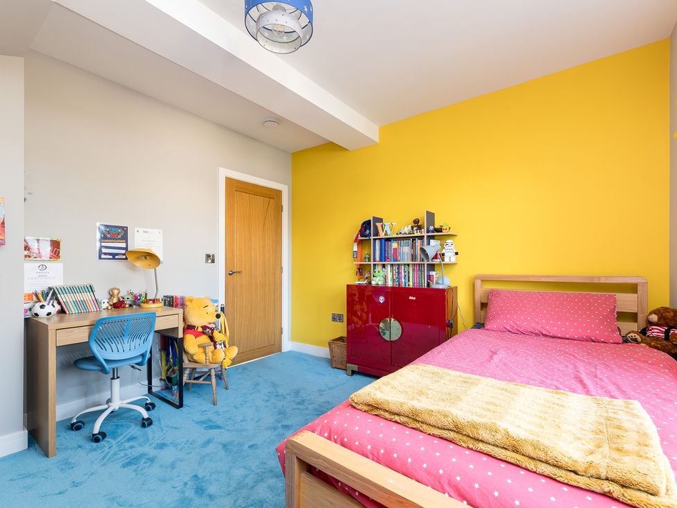 A bedroom with a bed and desk at The Grand Weave House in Shipley