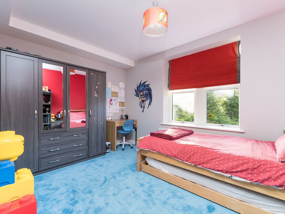 A bedroom with a bed and a desk at The Grand Weave House in Shipley