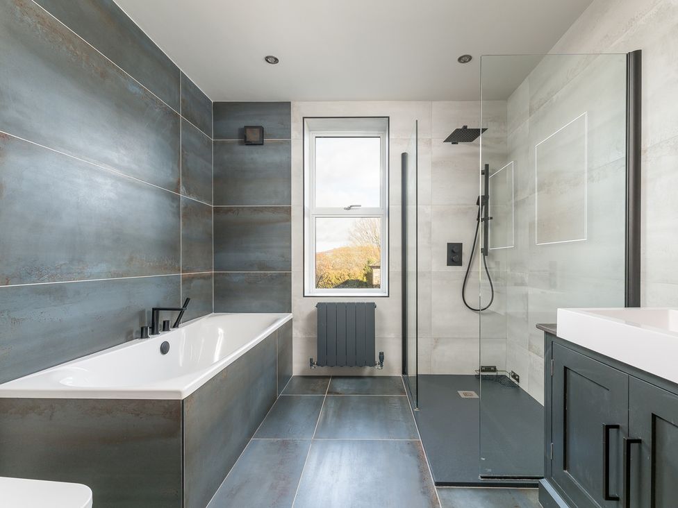 A bathroom with a bathtub and shower at The Grand Weave House in Shipley