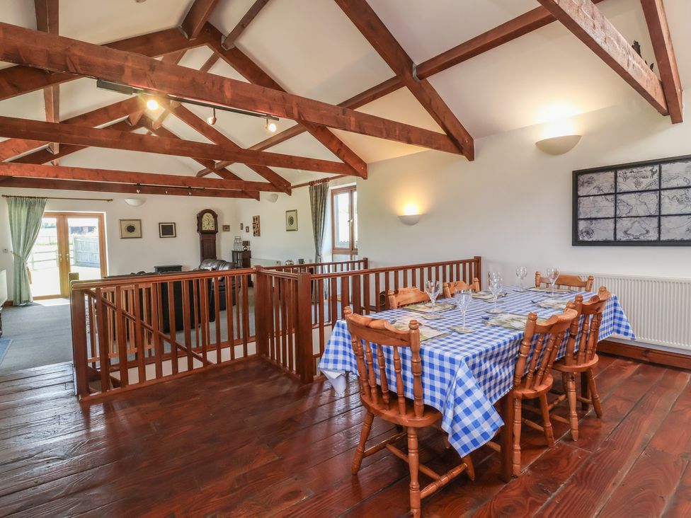 A dining room with a table and chairs at Little Owl Barn in Wellington