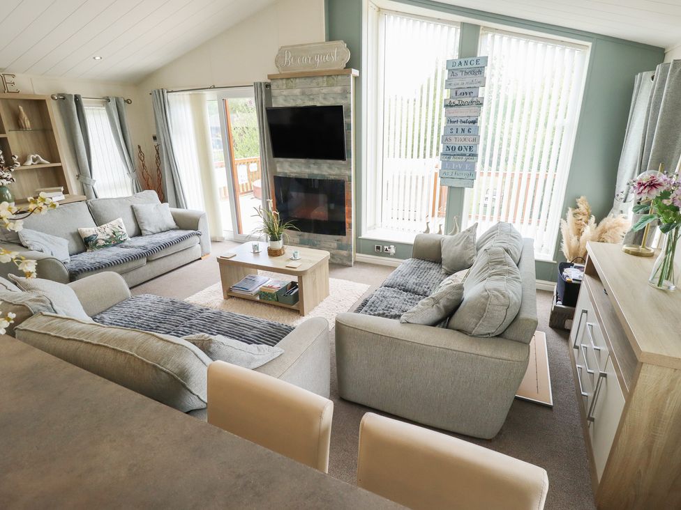 A living room with sofas and a television at P and M Luxury Lodge BR15 Tattershall