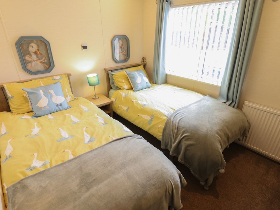 A bedroom with two beds at P and M Luxury Lodge BR15 Tattershall