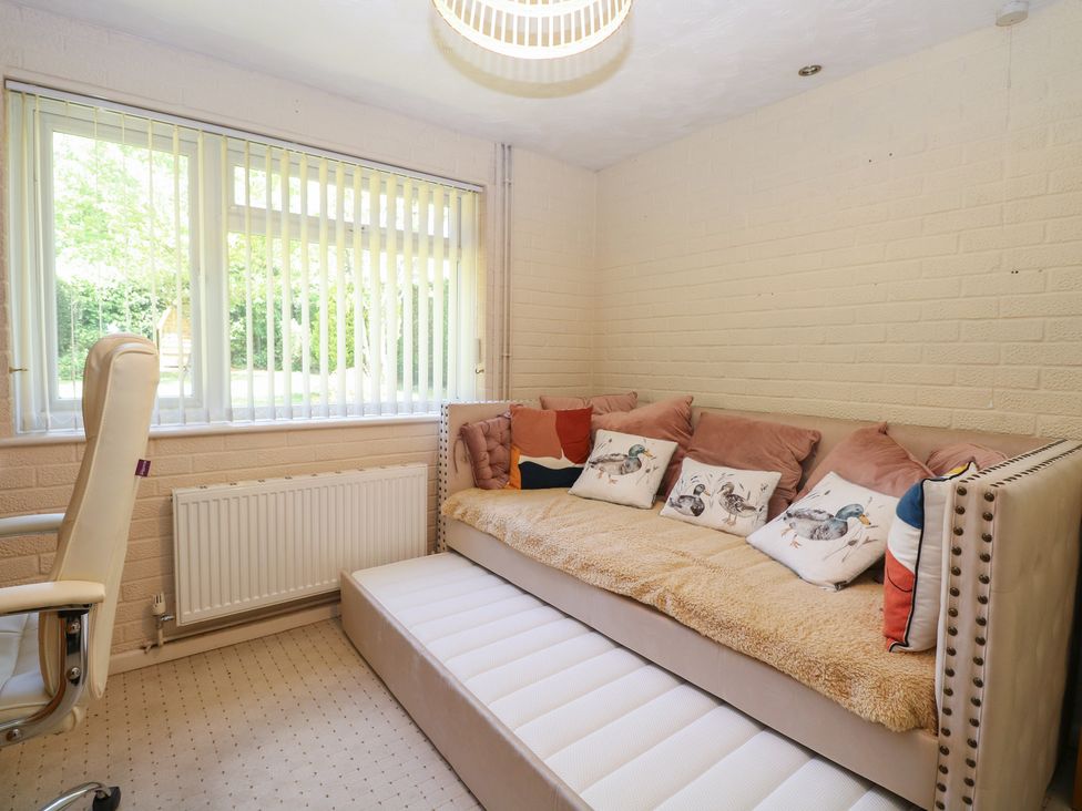 A snug with a sofa and chair at 51 Colin McLean Road Dereham