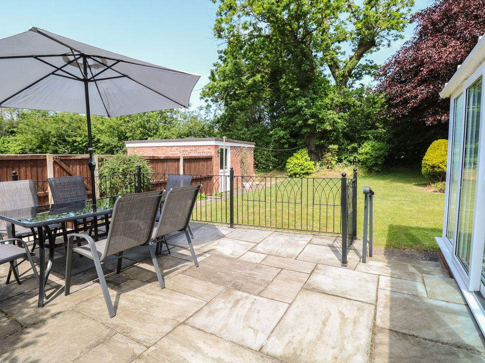 A patio with a table and chairs at 51 Colin McLean Road Dereham
