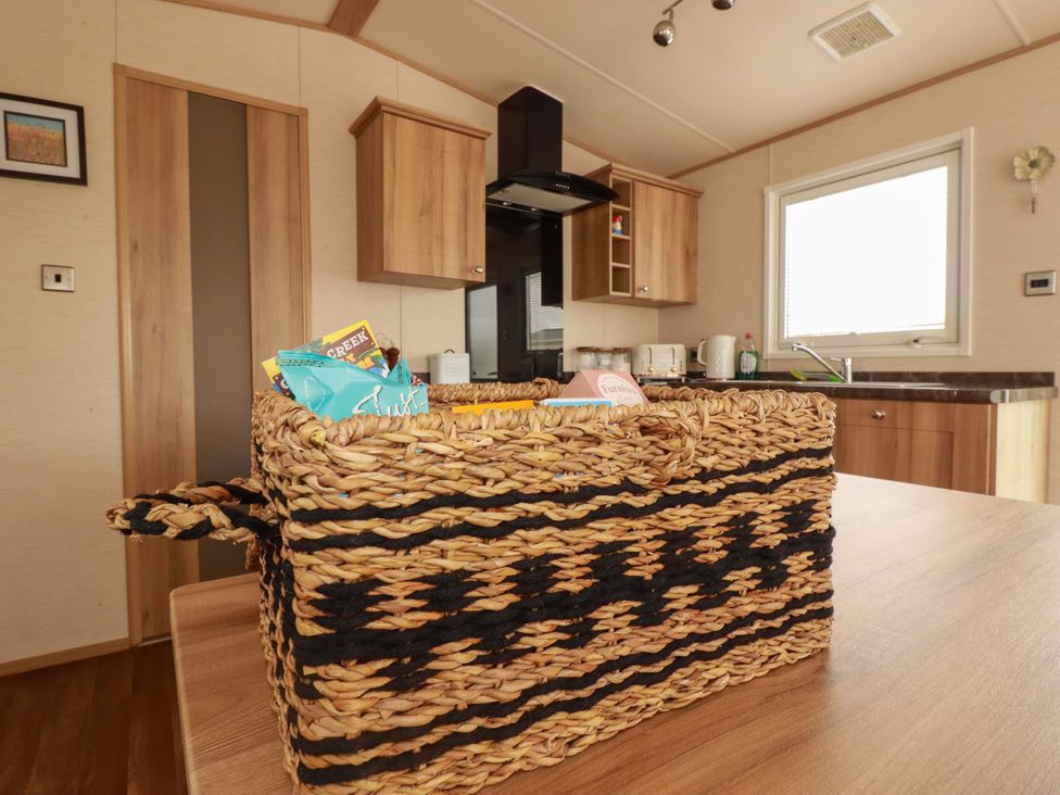 A kitchen with a basket on the table at CC2