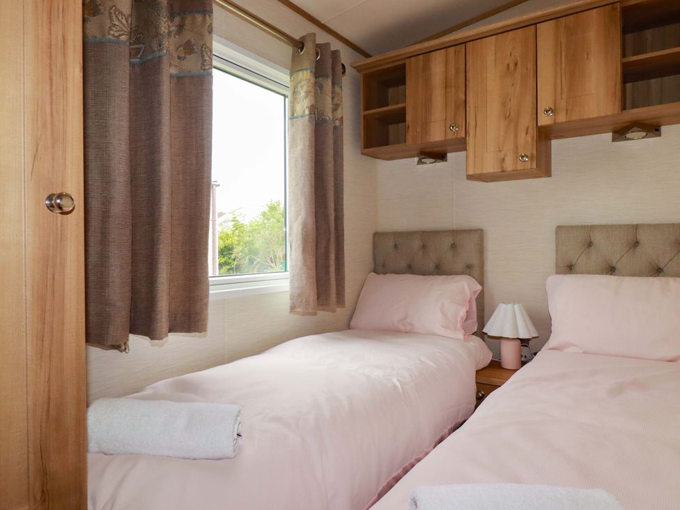 A bedroom with two beds and a window at CC2 
