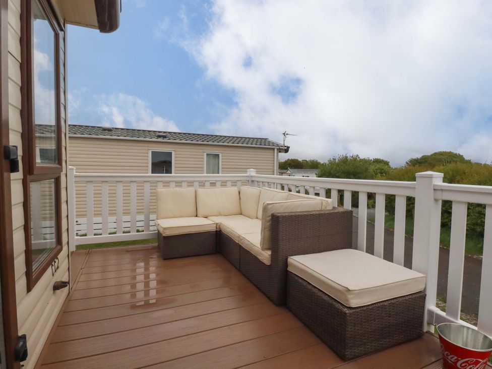 An outdoor space with a couch and bucket at CC2