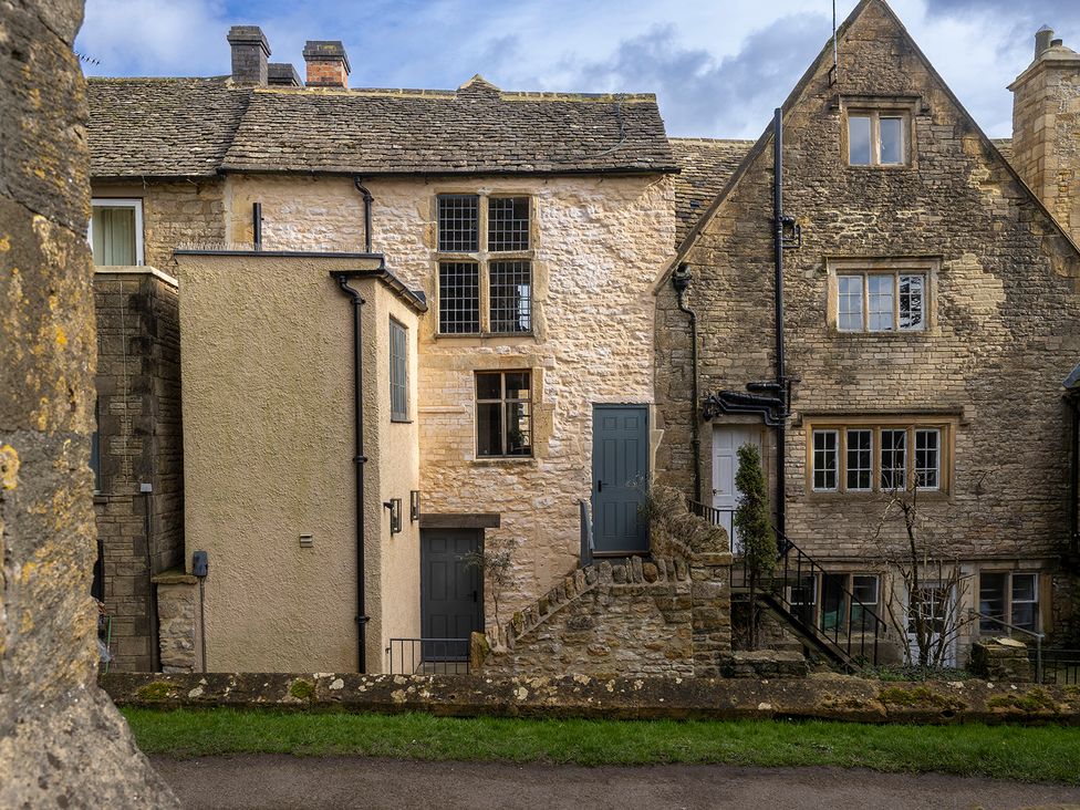 A view of buildings with brick and stone walls in Stow-On-The-Wold