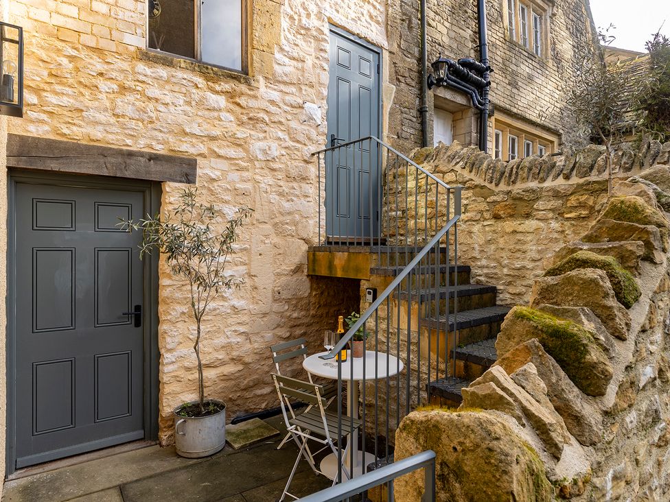 An outdoor area with stairs and a table at Church Alley House Stow-On-The-Wold
