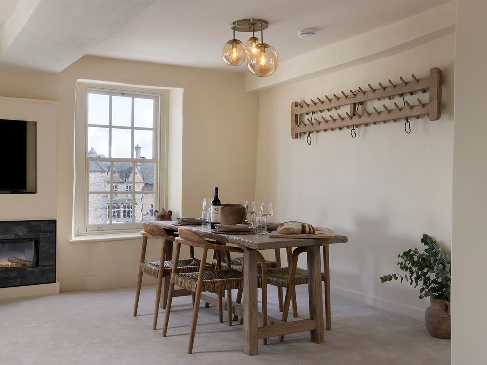 A dining room with a table and chairs at Church Alley House in Stow-On-The-Wold