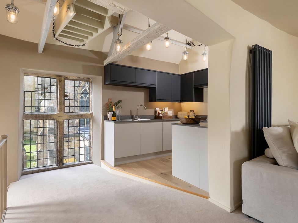 A kitchen with a window and appliances at Church Alley House in Stow-On-The-Wold
