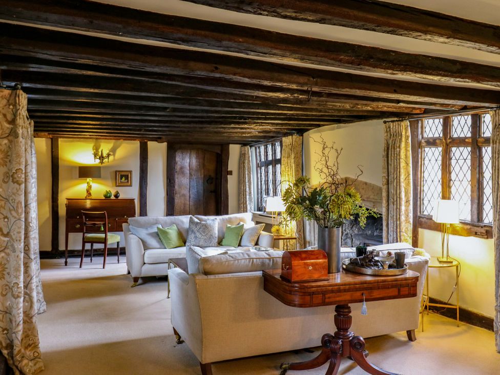 A living room with a sofa and armchair at Dukes Place