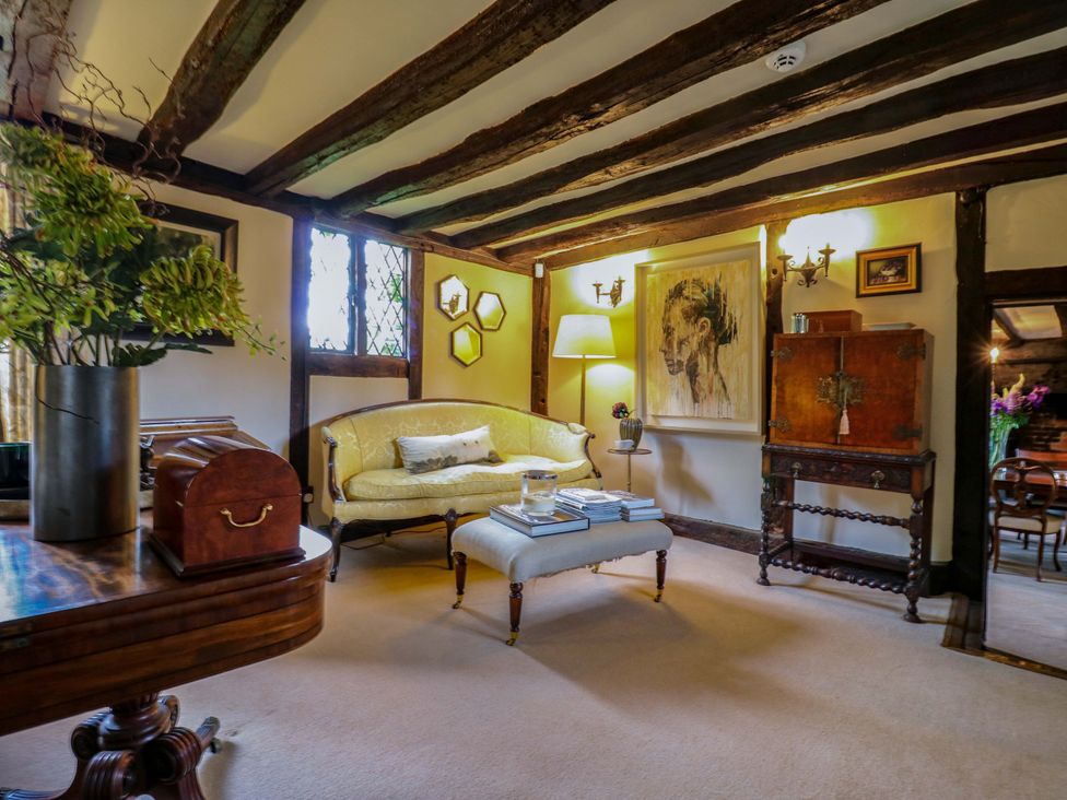 A living room with a sofa and table at Dukes Place