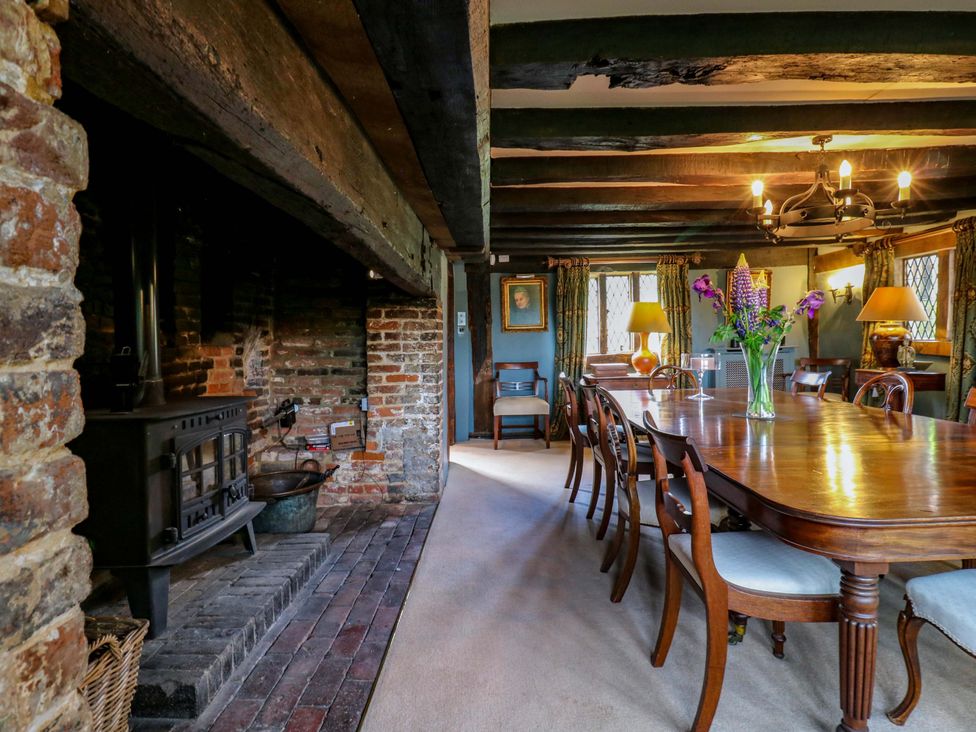 A dining room with a wooden table and chairs at Dukes Place