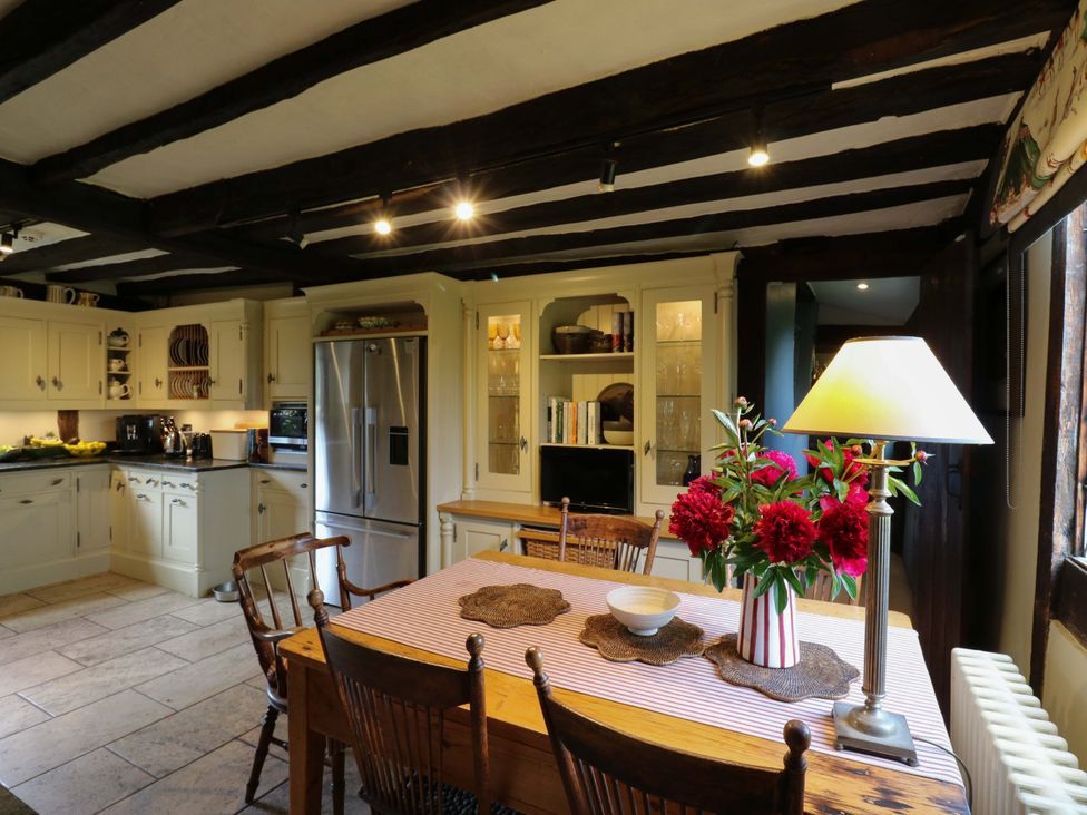A kitchen with a dining table and chairs at Dukes Place