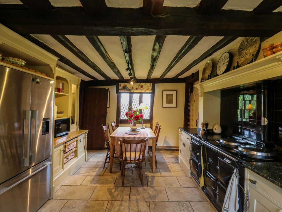 A kitchen with a dining table and chairs at Dukes Place