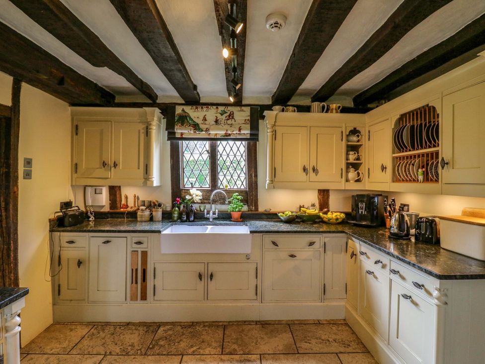 A kitchen with cabinets and a sink at Dukes Place
