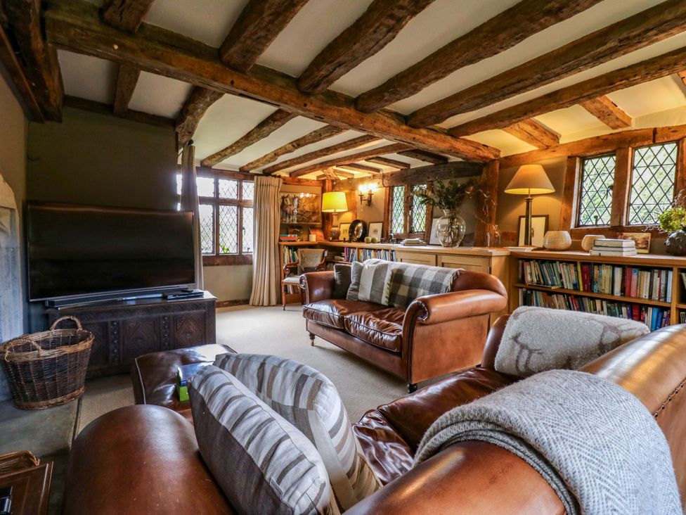 A living room with a sofa and a television at Dukes Place