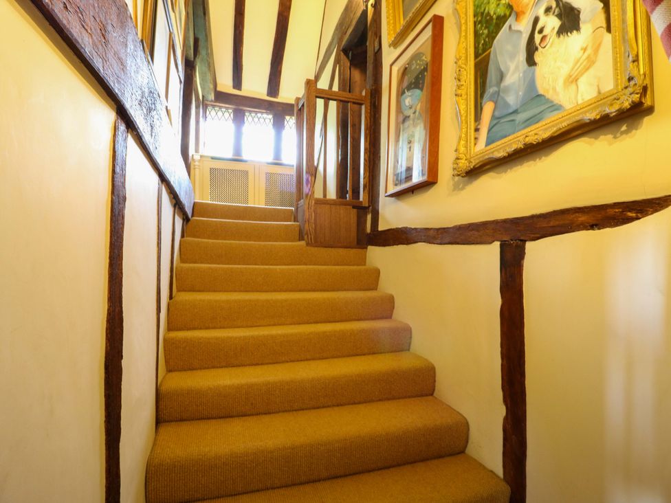 A staircase with paintings on the wall at Dukes Place