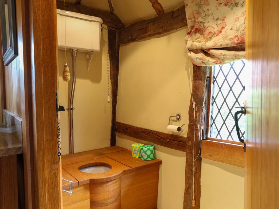 A bathroom featuring a toilet and sink at Dukes Place