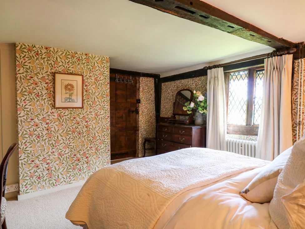 A bedroom with bed and wooden furniture at Dukes Place 