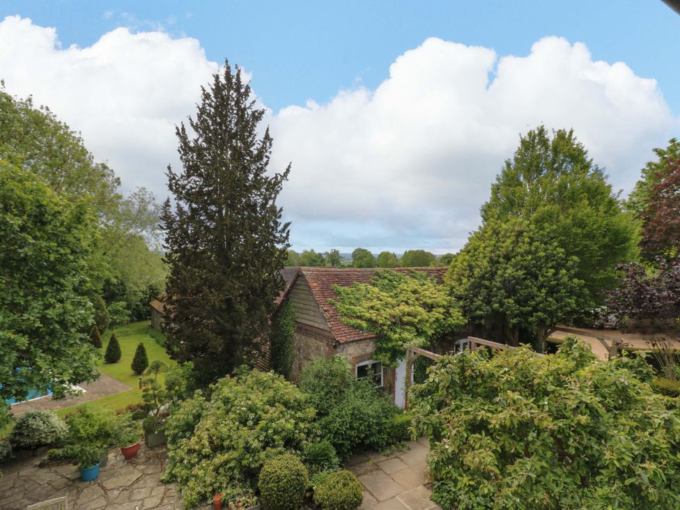 A garden view with trees and a building at Dukes Place 