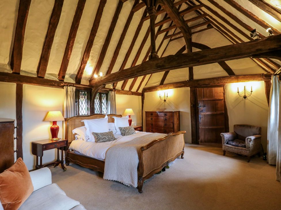 A bedroom with a bed and wooden beams at Dukes Place